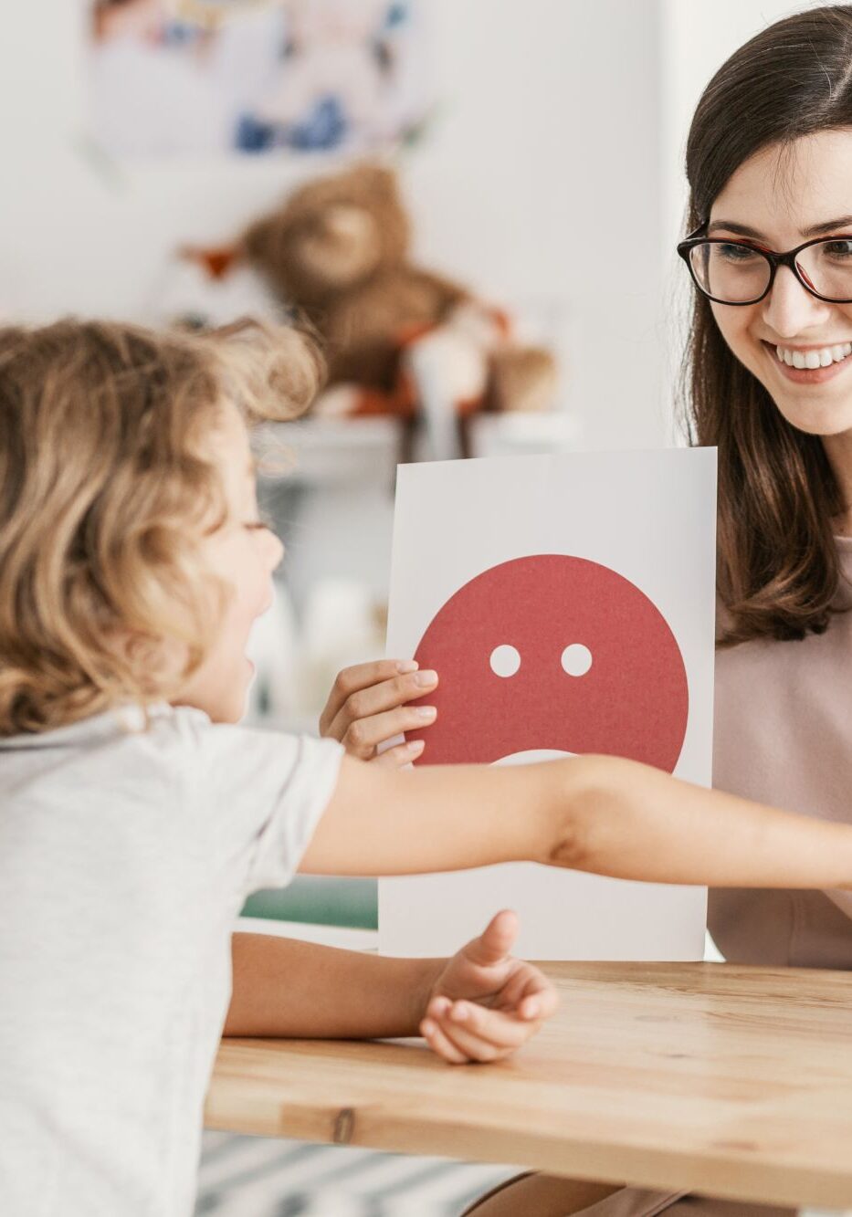 Psychologist guiding a child through a card-based psychoeducational assessment in Oakville